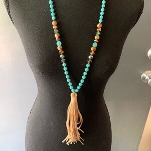Long boho natural stone/faceted bead necklace. 6 inch tassel.